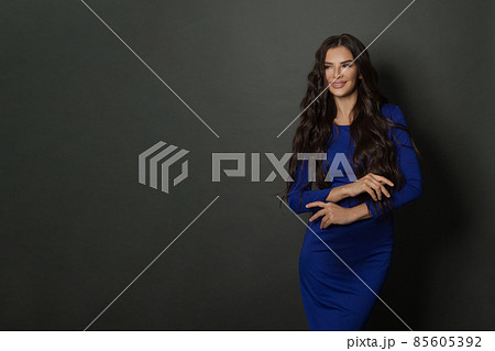 Attractive laughing woman brunette with long healthy curly hair. Attractive laughing woman brunette with long healthy curly hair. 85605392