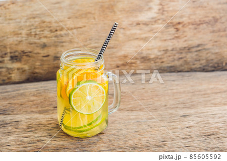 ice tea with slice of lemon in mason jar on the wooden rustic background 85605592