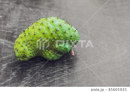 Guanabana on an old wooden background - exotic tropical fruit - regional fruits from Vietnam 85605935