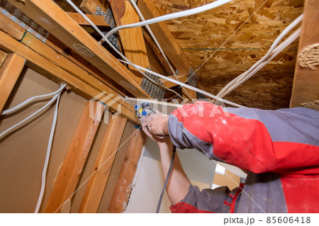 Home Interior damage for drywall board with repair home of man cutting plasterboard on using angle hand electric power tools Home Interior damage for drywall board with repair home of man cutting plasterboard on using angle hand electric power tools 85606418