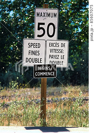 A Speed Fines Double Begins sign along a highway A Speed Fines Double Begins sign along a highway 85607075
