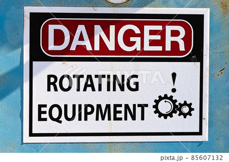 Closeup of a Danger Rotating Equipment sign Closeup of a Danger Rotating Equipment sign 85607132
