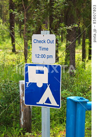 A camping check out time 12:00 pm message sign A camping check out time 12:00 pm message sign 85607803