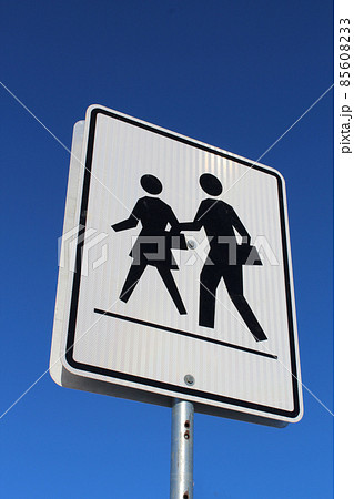 Crosswalk Sign Against Blue Sky 85608233