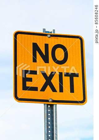 Close Up of No Exit Sign Against Cloudy Sky 85608246