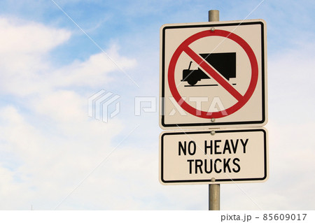 No Heavy Trucks Sign against Cloudy Blue Sky Background 85609017