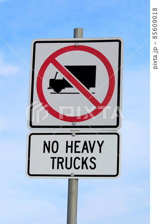 No Heavy Trucks Sign against Cloudy Blue Sky Background 85609018