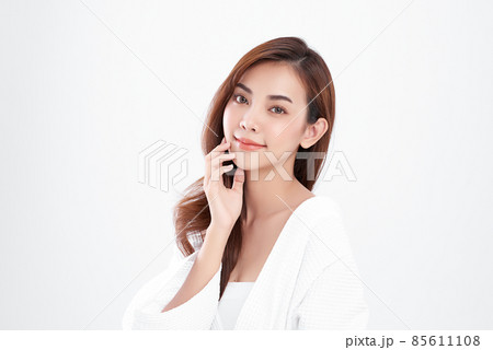 Beautiful young asian woman with clean fresh skin on white background, Face care, Facial treatment, 85611108