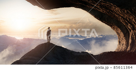 Dramatic Adventurous Scene with Woman standing inside a Rocky Cave Landscape Dramatic Adventurous Scene with Woman standing inside a Rocky Cave Landscape 85611364