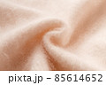 パステルなライトオレンジピンクのふわふわアンゴラニット地のテクスチャ　パターン 85614652