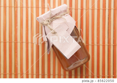 fresh honey in a glass jar with a paper empty label fresh honey in a glass jar with a paper empty label 85622050