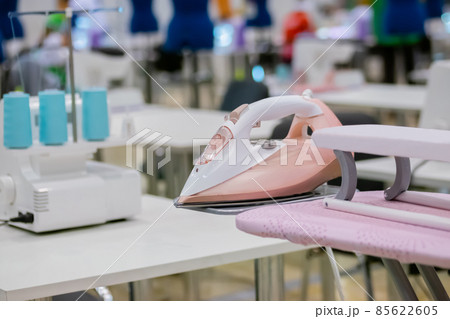 Tailor, fashion designer workplace - sewing machine on table at atelier 85622605