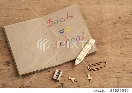 back to school template with a notebook on wooden table 85625936