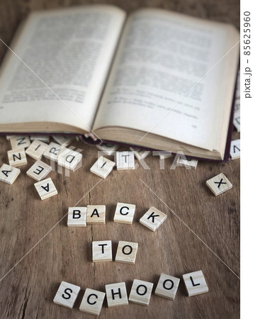 back to school template with cube letters and book 85625960