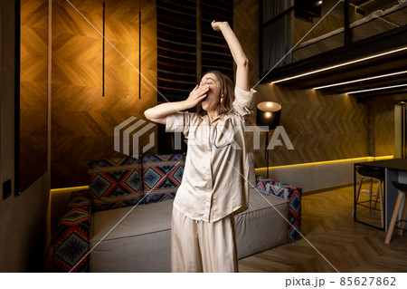 Woman waking at modern apartment 85627862