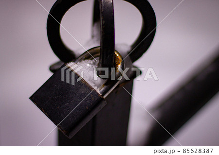 Metal pad lock on metal fence Metal pad lock on metal fence 85628387