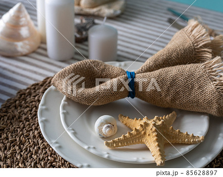 Marine style in the interior, table setting in a sea style 85628897