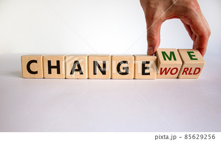 Change world or me symbol. Businessman turns wooden cubes and changes words 'change world' to 'change me'. Beautiful white background, copy space. Business and change yourself concept. 85629256