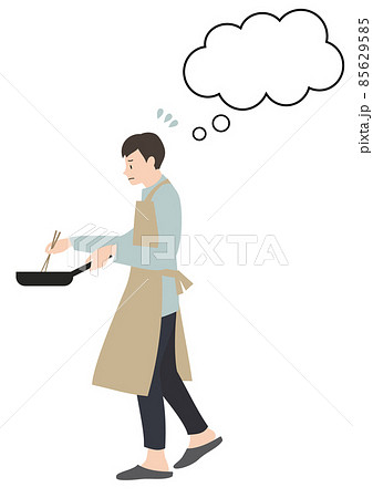 エプロンをして困った顔で料理をする男性（吹き出し付き・単身赴任や家事分担等のイメージに） 85629585
