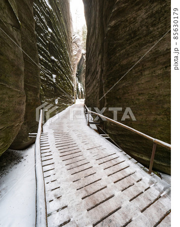 Scenic detail of path in Sandstone rocky labyrinth in Adrspach during winter Scenic detail of path in Sandstone rocky labyrinth in Adrspach during winter 85630179