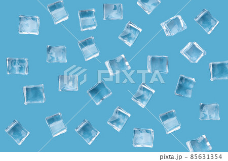 A pattern of randomly placed ice cubes on a blue background with a place for text. A pattern of randomly placed ice cubes on a blue background with a place for text. 85631354