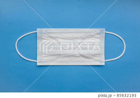 Medical mask isolated on background. Close-up of Coronavirus or COVID-19 protective face mask. Workwear prevents entry of Alpha, Beta, Gamma, Delta, Omicron into a body. Travel rules tightened over  85632193
