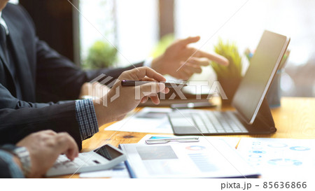 Male bankers analysing financial data together. Male bankers analysing financial data together. 85636866