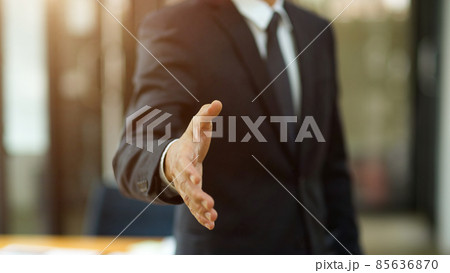 A business man in formal suit posting a greeting hand or shaking hand 85636870