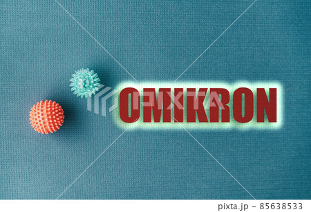 OMIKRON variant different from previous coronavirus. Blue ackground text sign. Omicron written in greek OMIKRON variant different from previous coronavirus. Blue ackground text sign. Omicron written in greek 85638533