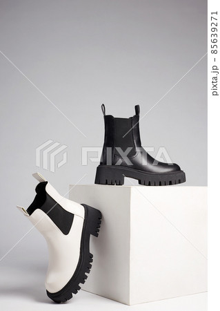 black and white boots. fashion shoes still life black and white boots. fashion shoes still life 85639271