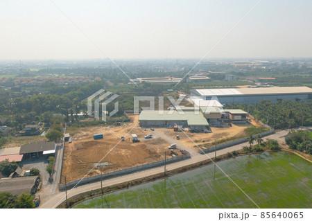 Aerial top view of dry ground rough cracks in the land with sand in factory industry for construction site. Arid pattern texture background. 85640065