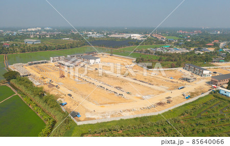 Aerial top view of dry ground rough cracks in the land with sand in factory industry for construction site. Arid pattern texture background. 85640066