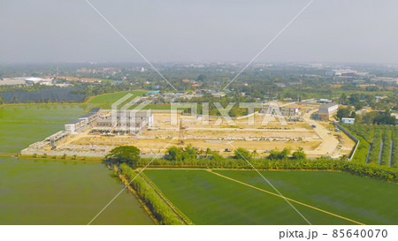 Aerial top view of dry ground rough cracks in the land with sand in factory industry for construction site. Arid pattern texture background. Aerial top view of dry ground rough cracks in the land with sand in factory industry for construction site. Arid pattern texture background. 85640070
