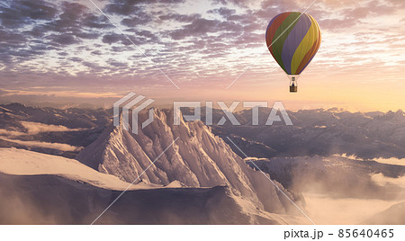 Dramatic Mountain Landscape covered in clouds and Hot Air Balloon Flyin Dramatic Mountain Landscape covered in clouds and Hot Air Balloon Flyin 85640465