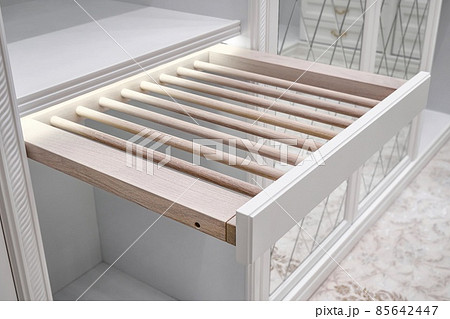 Cabinet with slide out rack for trousers in walk-in closet 85642447