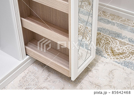 White walk-in closet with vertical slide out wooden cabinet 85642468