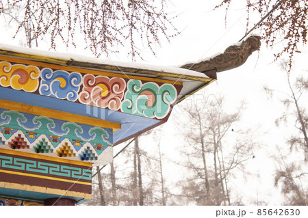 The roof of the Buddhist monastery is a traditional Tibest ornament on wood Buryat religion 85642630