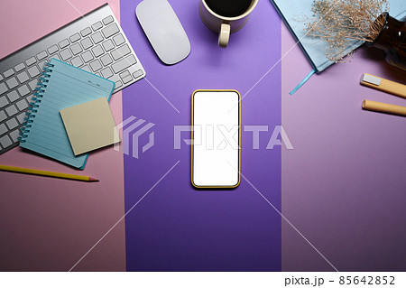 Smart phone, coffee cup and stationery on purple background. 85642852