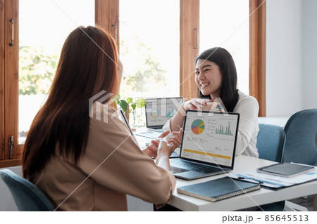 Asian business adviser meeting to analyze and discuss the situation on the financial report in the meeting room.Investment Consultant, Financial advisor and accounting concept 85645513