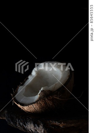 Chopped coconut on a wooden board close up 85645555