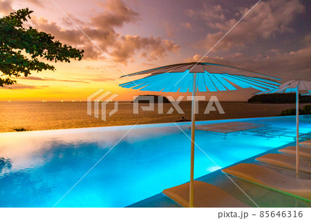 Sunset at the edge of a swimming pool at Kata beach in Phuket province, in Thailand 85646316