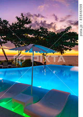 Sunset at the edge of a swimming pool at Kata beach in Phuket province, in Thailand Sunset at the edge of a swimming pool at Kata beach in Phuket province, in Thailand 85646499