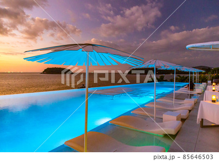 Sunset at the edge of a swimming pool at Kata beach in Phuket province, in Thailand 85646503