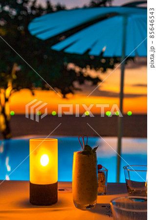 Sunset at the edge of a swimming pool at Kata beach in Phuket province, in Thailand Sunset at the edge of a swimming pool at Kata beach in Phuket province, in Thailand 85646543