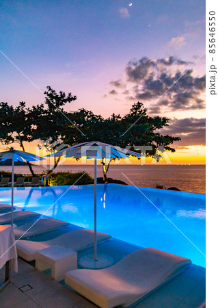 Sunset at the edge of a swimming pool at Kata beach in Phuket province, in Thailand 85646550