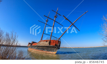 Stranded sailing ship at shore of lake Erie Stranded sailing ship at shore of lake Erie 85646745