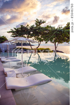Sunset at the edge of a swimming pool at Kata beach in Phuket province, in Thailand Sunset at the edge of a swimming pool at Kata beach in Phuket province, in Thailand 85646760