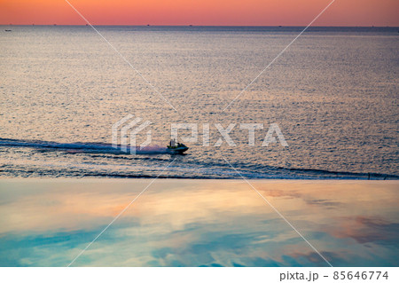 Sunset at the edge of a swimming pool at Kata beach in Phuket province, in Thailand Sunset at the edge of a swimming pool at Kata beach in Phuket province, in Thailand 85646774