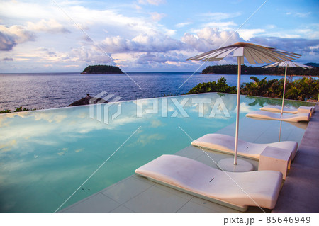 Sunset at the edge of a swimming pool at Kata beach in Phuket province, in Thailand 85646949