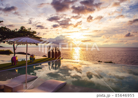 Sunset at the edge of a swimming pool at Kata beach in Phuket province, in Thailand 85646955